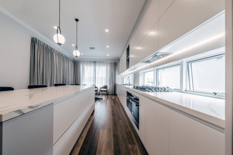 Flat panel custom kitchen with marble bench top